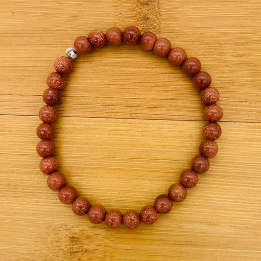 C1235BL 6mm.6.5" Goldstone Bracelet