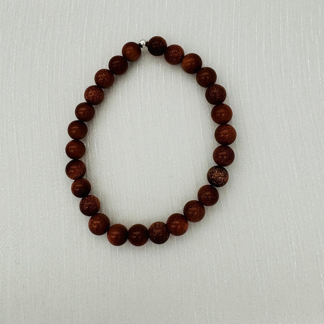 C1235BL Goldstone Bracelet 8mm.7.5"