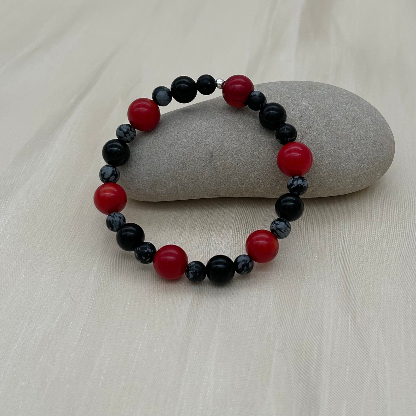 ST1120BL Obsidian & Red Dyed Bamboo Coral Bracelet 7"