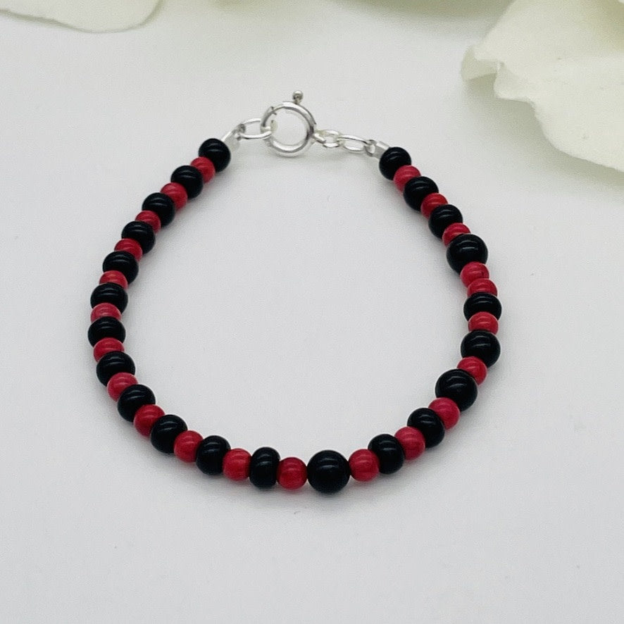 CH941BL Rede Dyed Bamboo Coral and Onyx Bracelete 6"