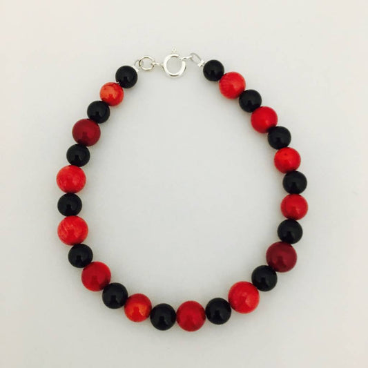 ST1077BL Black Onyx & Red Dyed Bamboo Coral Bracelet 7"