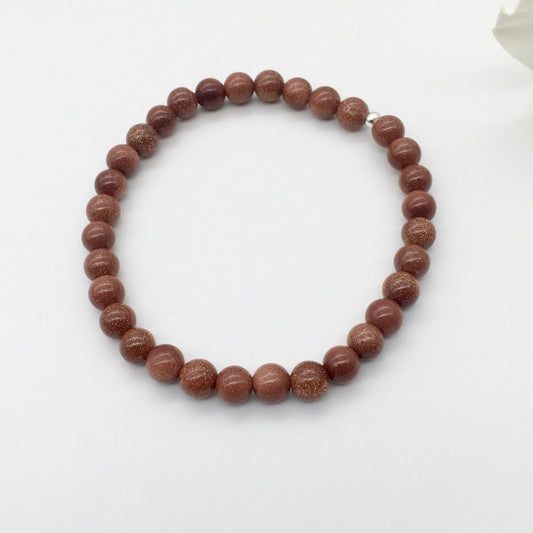 C1235BL Goldstone Bracelet 6mm. x 7"