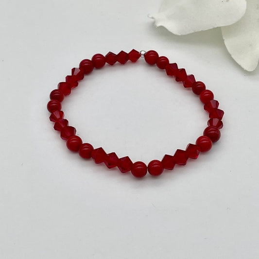 ST1504BL Red Dyed Bamboo Coral Bracelet  7"